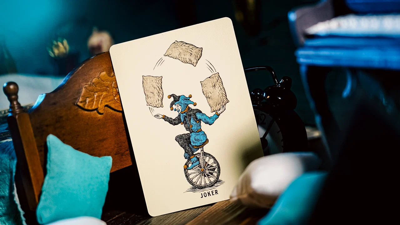 Sleep Walk Joker juggling pillows while riding a unicycle
