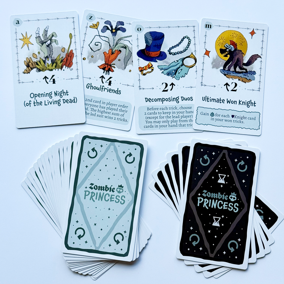 Zombie Princess Deluxe Edition round cards and green and black card-back designs.
